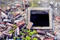 Pile of old rubble red bricks of a demolished building and a hole in a construction site Royalty Free Stock Photo