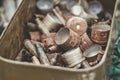 Pile of old rusty shell casings from assault rifles and mounted grenade launchers in metal box Royalty Free Stock Photo