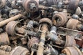 Pile of old rusty truck axle for reusing, used automotive part for sale, old rear differential of