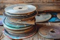 Pile of Old and Scratched CDs and DVDs in Various Conditions Representing Digital Storage Evolution Royalty Free Stock Photo