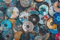 Pile of Old and Scratched CDs and DVDs in Various Conditions Representing Digital Storage Evolution Royalty Free Stock Photo