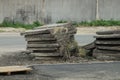 Pile of old square concrete slabs