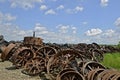 Pile of old steam engines wheels for salvage.