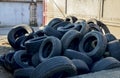 Pile of old tires and wheels for rubber recycling. Royalty Free Stock Photo