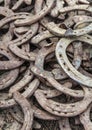 Pile of old used and rusty horseshoes