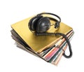 Pile of old vinyl records and vintage headphones isolated. Royalty Free Stock Photo