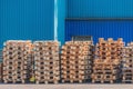 Pile of old wooden pallet by the plant