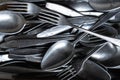 Pile of old worn vintage cutlery. Background of aluminium forks and spoons. Top view Royalty Free Stock Photo