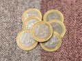 Pile of one euro coins on cashmere background Royalty Free Stock Photo