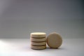 Pile of orange flavored pharmaceutical effervescent tablets with white background