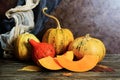 Pile of orange harvested pumpkins on wooden table, retro toned. Thanksgiving Day concept. Royalty Free Stock Photo