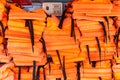 A pile of orange life jackets on a passenger ship