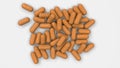 Pile of orange medicine capsules