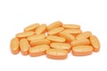 Pile of orange pills Royalty Free Stock Photo