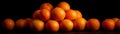 A Pile of Oranges, Black Background, Fruit Concept Royalty Free Stock Photo