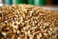 A pile of organic biofuel wooden pellets made from compacted sawdust and by-product of woodworking operations. Alternative energy