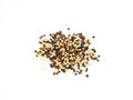 A pile organic tri-color Quinoa isolated on a white background.