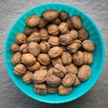 Pile of organic walnuts in a bowl, close up Royalty Free Stock Photo