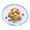 Pile of pancakes with blueberries sprinkled with icing sugar Royalty Free Stock Photo