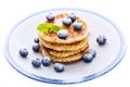 Pile of pancakes with blueberries sprinkled with icing sugar Royalty Free Stock Photo