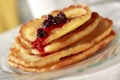 Pile of pancakes with fruit sauce