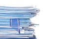 Pile of paper with bookmark isolated on white background. Royalty Free Stock Photo