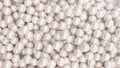 Pile of pearls. Background of the plurality of beautiful pearls. Gems, women`s jewelry, nacre beads. Background For your