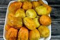 A pile of peeled fresh prickly pear fruit in a plate on wooden background, Opuntia, commonly called prickly pear, Barbary