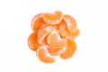 Pile of peeled orange parts isolated on white background. Juicy mandarin slices Royalty Free Stock Photo