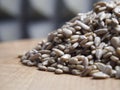 A pile of peeled sunflower seeds on a wooden surface, macro shot. Seeds without shell Royalty Free Stock Photo