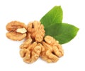 Pile of peeled walnuts and leaves on white background, top view Royalty Free Stock Photo