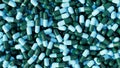 Pile of pills background, pill capsules in blue and green. drug or vitamin capsules. Pharmaceutical Royalty Free Stock Photo