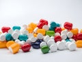 A pile of pills on a white table Royalty Free Stock Photo