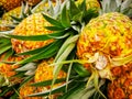 Pile pineapple fruit which has been harvested and display for sale on farmers table in market