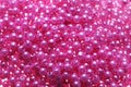 Pile of pink beads as background, closeup Royalty Free Stock Photo