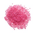 Pile of pink beads on white background, top view Royalty Free Stock Photo