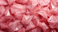 A pile of pink plastic triangles