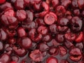 A pile of pitted red cherries in cherry juice