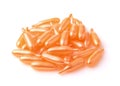 Pile of plastic orange capsules