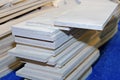 Pile from plywood strips on a blue background Royalty Free Stock Photo