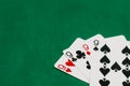 A pile of Poker playing card, playing cards on green background