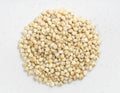 Pile of polished Sorghum groats close up on gray Royalty Free Stock Photo