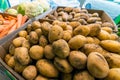 Pile potatoes in box closeup at the local market