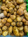 Pile of potatoes selling at farmer`s market vendor Royalty Free Stock Photo