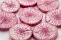 Pile of purple daikon radish slice isolated on white background