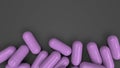 Pile of purple medicine capsules