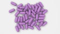 Pile of purple medicine capsules