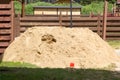 pile of quarry sand lies on grass