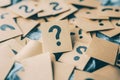 Pile of Question Mark Notes on a Soft Textured Background in a Creative Conceptual Scene Royalty Free Stock Photo