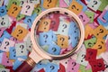 Pile of question marks and magnifying glass Royalty Free Stock Photo